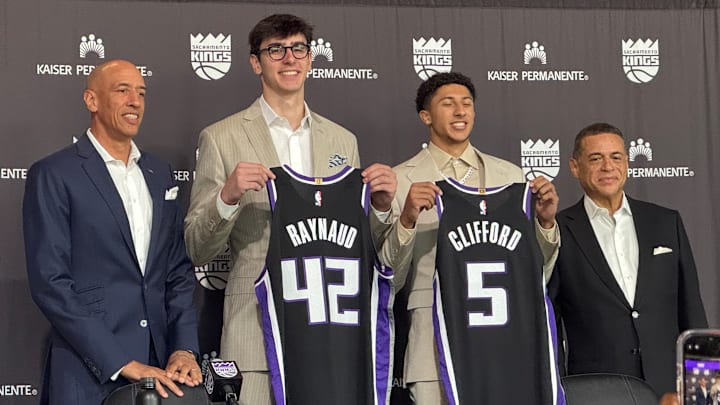 Maxime Raynaud and Nique Cliffard hold up their Sacramento Kings jerseys at their introductory press conference Maxime Raynaud and Nique Cliffard hold up their Sacramento Kings jerseys at their introductory press conference