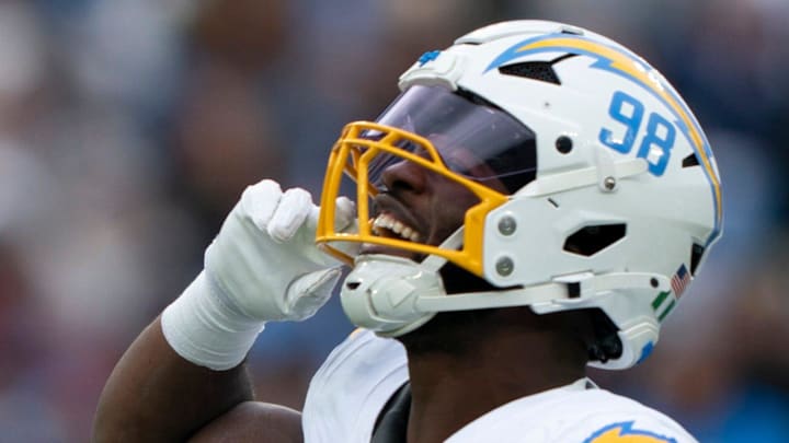 Los Angeles linebacker Odafe Oweh (98) celebrates his Tennessee quarterback Cam Ward (1) sack during the second half of their game at Nissan Stadium in Nashville, Tenn., Sunday, Nov. 2, 2025. Los Angeles linebacker Odafe Oweh (98) celebrates his Tennessee quarterback Cam Ward (1) sack during the second half of their game at Nissan Stadium in Nashville, Tenn., Sunday, Nov. 2, 2025.