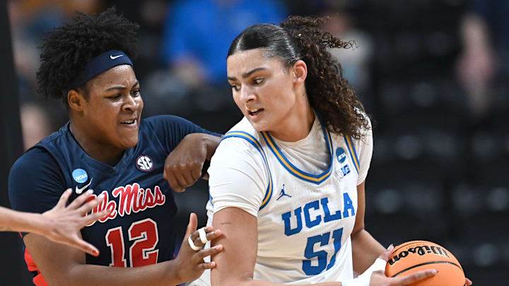 Mar 28, 2025; Spokane, WA, USA; UCLA Bruins center Lauren Betts (51) fights for position against Ole Miss Rebels forward Christeen Iwuala (12). during the first half of a Sweet 16 NCAA Tournament basketball game at Spokane Arena. at Spokane Arena. Mandatory Credit: James Snook-Imagn Images