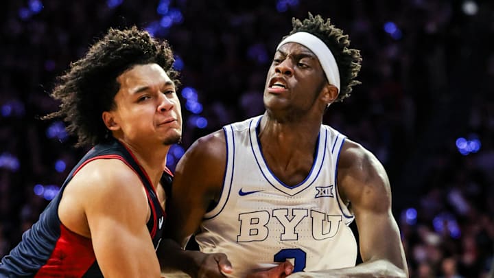 Feb 18, 2026; Tucson, Arizona, USA; Brigham Young Cougars forward AJ Dybantsa (3) dribbles the ball while Arizona Wildcats guard Brayden Burries (5) attempts to block him during the first half of the game at McKale Memorial Center. Mandatory Credit: Aryanna Frank-Imagn Images