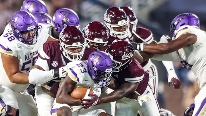 Alcorn State Braves running back Tylan Citizen (23) is tackled by several Mississippi State Bulldogs defenders during the second half at Davis Wade Stadium at Scott Field.