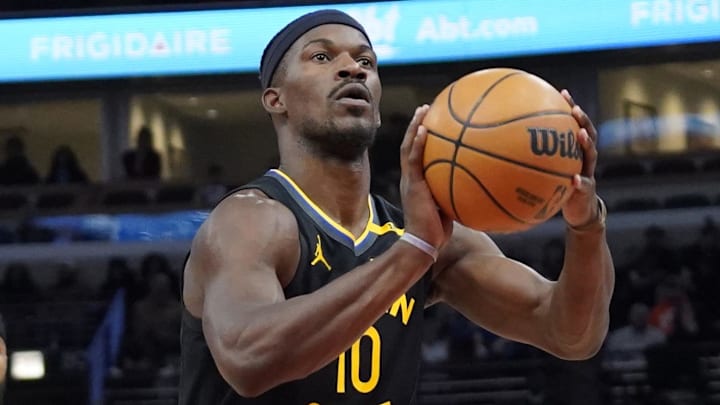 Feb 8, 2025; Chicago, Illinois, USA; Golden State Warriors forward Jimmy Butler (10) shoots a free throw against the Chicago Bulls during the first half at United Center. Mandatory Credit: David Banks-Imagn Images