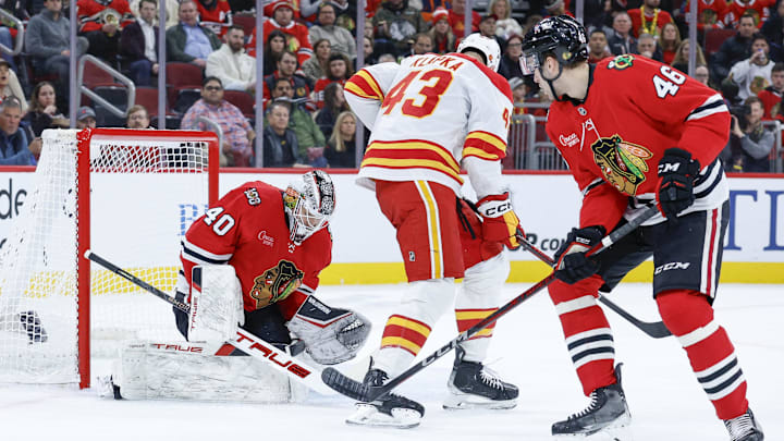 Nov 18, 2025; Chicago, Illinois, USA; Chicago Blackhawks goaltender Arvid Soderblom (40) defends against Calgary Flames right wing Adam Klapka (43) during the first period at United Center. Mandatory Credit: Kamil Krzaczynski-Imagn Images