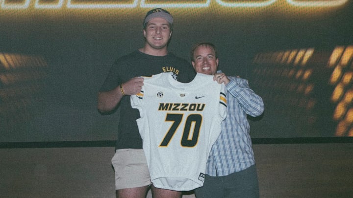 4-star Missouri football recruit Evan Goodwin stands in a photo with Missouri football head coach Eliah Drinkwitz on his official visit. 