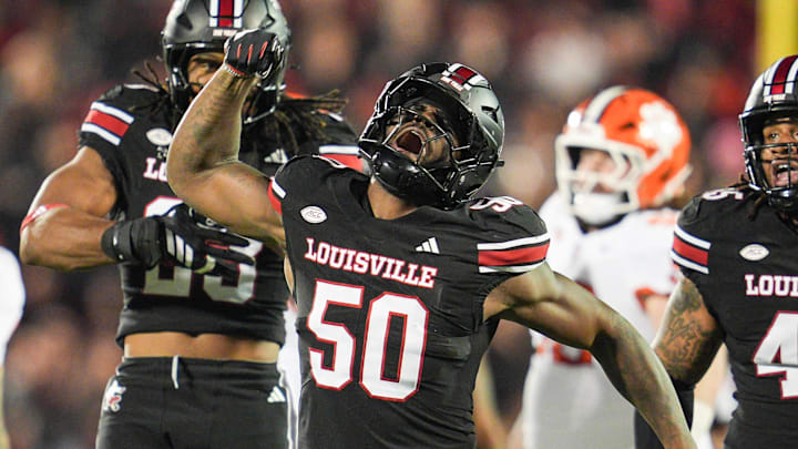 Louisville Cardinals defensive lineman Clev Lubin (50) celebrates his tackle of Clemson Tigers quarterback Cade Klubnik (2) in the first half at L&N Stadium Friday, Nov. 14, 2025.