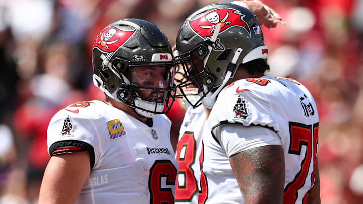 Sep 29, 2024; Tampa, Florida, USA; Tampa Bay Buccaneers offensive tackle Tristan Wirfs (78) congratulates quarterback Baker Mayfield (6) after a touchdown against the Philadelphia Eagles in the second quarter at Raymond James Stadium. Mandatory Credit: Nathan Ray Seebeck-Imagn Images