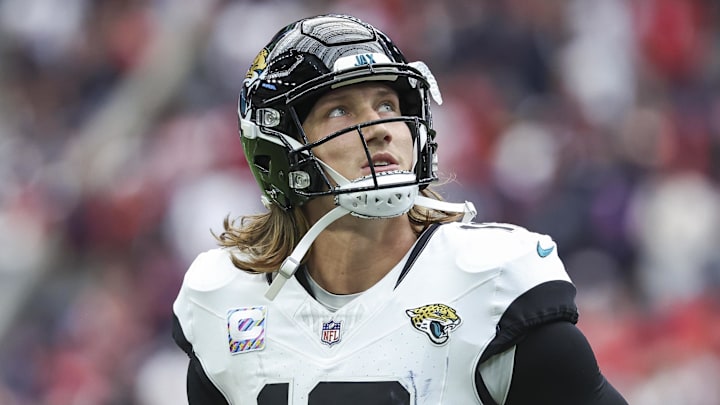 Sep 29, 2024; Houston, Texas, USA; Jacksonville Jaguars quarterback Trevor Lawrence (16) jogs off the field after a play during the fourth quarter against the Houston Texans at NRG Stadium. Mandatory Credit: Troy Taormina-Imagn Images