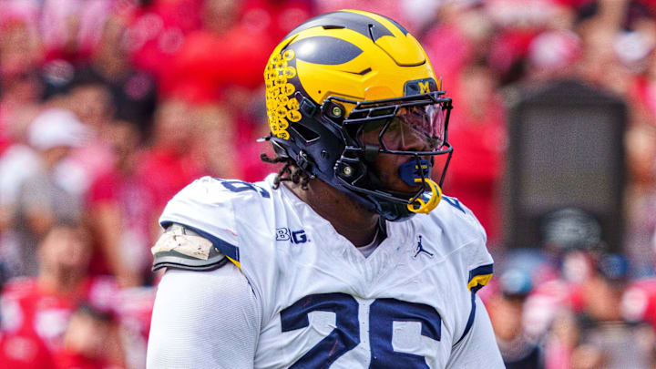 Sep 20, 2025; Lincoln, Nebraska, USA; Michigan Wolverines defensive lineman Rayshaun Benny (26) reacts after a sack against the Nebraska Cornhuskers during the second quarter at Memorial Stadium. Mandatory Credit: Dylan Widger-Imagn Images