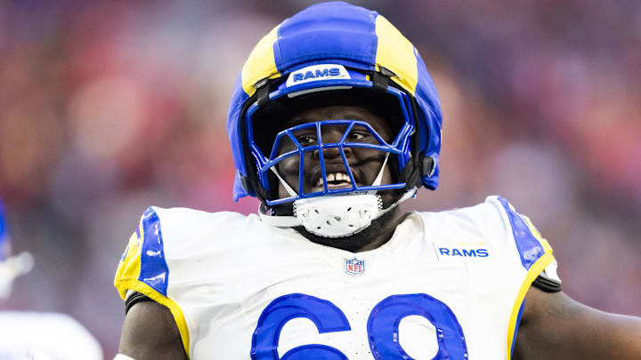 Dec 7, 2025; Glendale, Arizona, USA; Los Angeles Rams  offensive lineman Kevin Dotson (69) against the Arizona Cardinals at State Farm Stadium. Mandatory Credit: Mark J. Rebilas-Imagn Images