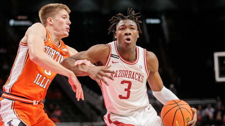 Arkansas Razorbacks forward Adou Thiero (3) drives around Illinois Fighting Illini forward Ben Humrichous (3) during the first half at T-Mobile Center in Kansas City.