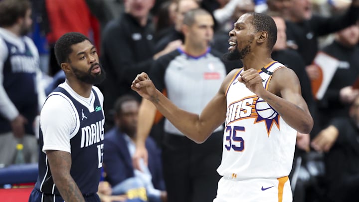 Nov 8, 2024; Dallas, Texas, USA;  Phoenix Suns forward Kevin Durant (35) reacts in front of Dallas Mavericks forward Naji Marshall (13) during the fourth quarter at American Airlines Center. Mandatory Credit: Kevin Jairaj-Imagn Images