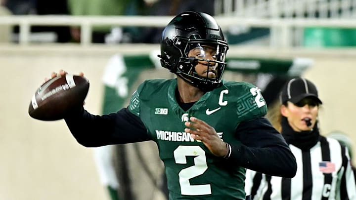 Nov 22, 2024; East Lansing, Michigan, USA;  Michigan State Spartans quarterback Aidan Chiles (2) throws upfield against the Purdue Boilermakers during the second quarter at Spartan Stadium. Mandatory Credit: Dale Young-Imagn Images