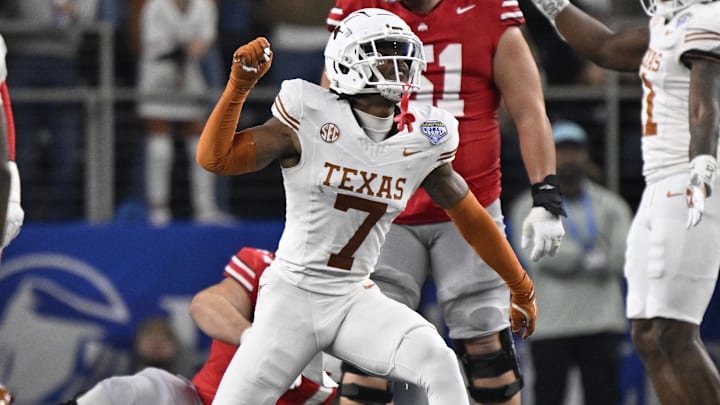 Jan 10, 2025; Arlington, Texas, USA; Texas Longhorns defensive back Jahdae Barron (7) celebrates after a sack during the second quarter of the College Football Playoff semifinal against the Ohio State Buckeyes in the Cotton Bowl at AT&T Stadium