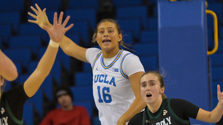 Dec 16, 2025; Los Angeles, California, USA; UCLA Bruins forward Sienna Betts (16) and Cal Poly Mustangs forward Nora Perez (9) battle for position under the basket during the second half at Pauley Pavilion presented by Wescom Financial. Mandatory Credit: Jayne Kamin-Oncea-Imagn Images