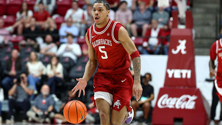 Feb 18, 2026; Tuscaloosa, Alabama, USA; Arkansas Razorback guard Darius Acuff Jr. (5) dribbles a fast break during the first half against the Alabama Crimson Tide at Coleman Coliseum. Mandatory Credit: David Leong-Imagn Images