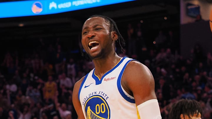 Dec 6, 2023; San Francisco, California, USA; Golden State Warriors forward Jonathan Kuminga (00) reacts after a dunk against the Portland Trail Blazers during the fourth quarter at Chase Center. Mandatory Credit: Kelley L Cox-Imagn Images