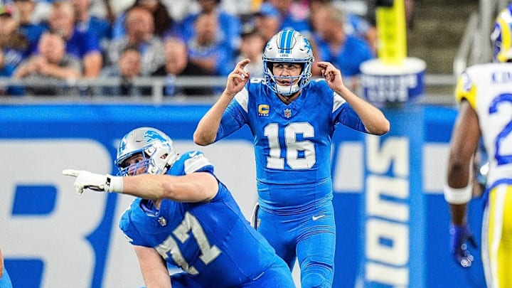 Detroit Lions quarterback Jared Goff (16) talks to center Frank Ragnow (77) before a snap against Los Angeles Rams 