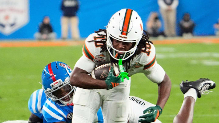Miami Hurricanes wide receiver Malachi Toney (10) carries the ball against the Mississippi Rebels in the first half during the Vrbo Fiesta Bowl and CFP semifinal game at State Farm Stadium on Jan. 8, 2026, in Glendale.