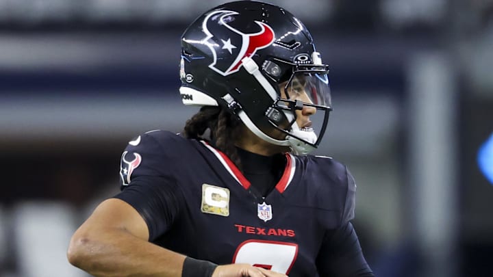 Nov 18, 2024; Arlington, Texas, USA;  Houston Texans quarterback C.J. Stroud (7) warms up before the game against the Dallas Cowboys at AT&T Stadium. Mandatory Credit: Kevin Jairaj-Imagn Images