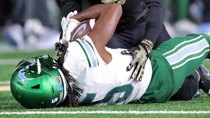 Dec 6, 2024; West Point, NY, USA; Army Black Knights cornerback Justin Weaver (5) tackles Tulane Green Wave wide receiver Yulkeith Brown (5) during the second half at Michie Stadium