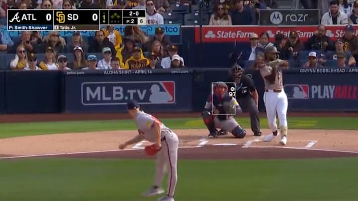 Fernando Tatis checks his swing but makes contact with the ball against the Atlanta Braves.