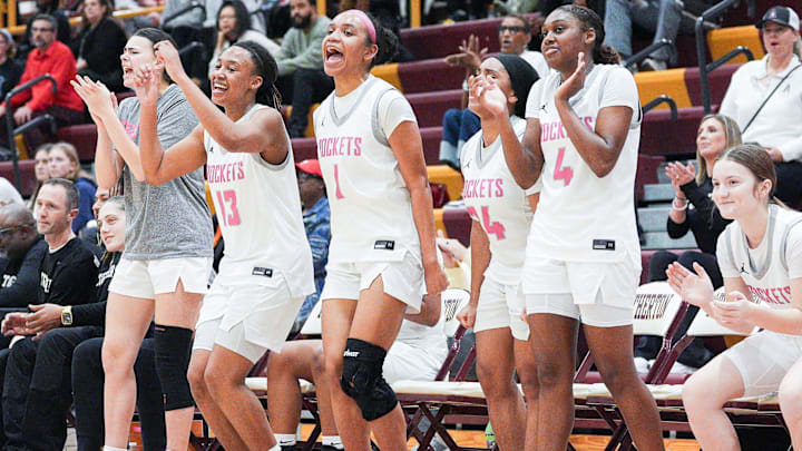 The Assumption starters cheer for their fourth-quarter replacements as the Rockets roll past DuPont Manual during the 7th Region KHSAA girls basketball semifinal at Atherton High School in Louisville, Kentucky. March 5, 2026.