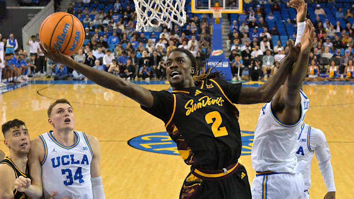 Dec 17, 2025; Los Angeles, California, USA;  Arizona State Sun Devils guard Anthony Johnson (2) drives past UCLA Bruins guard Eric Dailey Jr. (3) for a basket in the second half at Pauley Pavilion presented by Wescom Financial. Mandatory Credit: Jayne Kamin-Oncea-Imagn Images 