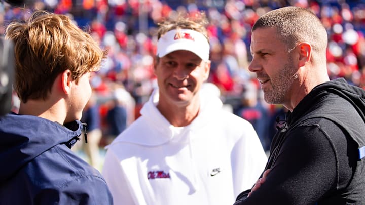 Florida Gators head coach Billy Napier talks with Mississippi Rebels head coach Lane Kiffin