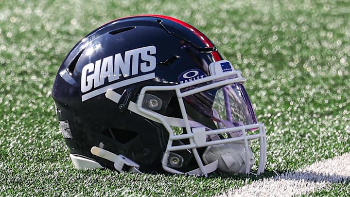 Nov 3, 2024; East Rutherford, New Jersey, USA; A New York Giants helmet rests on the turf before the game between the Giants and the Washington Commanders at MetLife Stadium.  