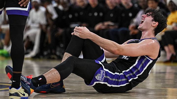 Oct 10, 2026; San Francisco, California, USA;  Sacramento Kings center Maxime Raynaud (42) holds his knee in pain during the second quarter Golden State Warriors at Chase Center.  Mandatory Credit: Justine Willard-Imagn Images
