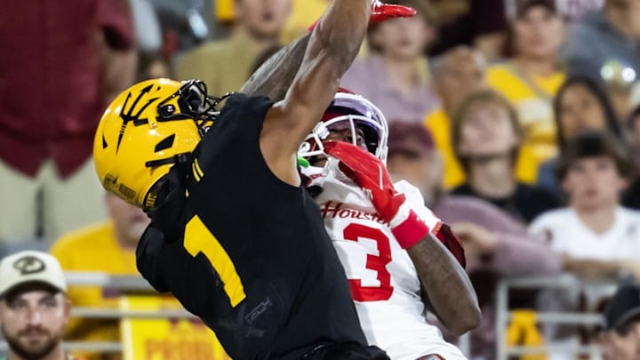 Oct 25, 2025; Tempe, Arizona, USA; Arizona State Sun Devils defensive back Keith Abney II (1) commits pass interference against Houston Cougars wide receiver Harvey Broussard III (3) in the second half at Mountain America Stadium. Oct 25, 2025; Tempe, Arizona, USA; Arizona State Sun Devils defensive back Keith Abney II (1) commits pass interference against Houston Cougars wide receiver Harvey Broussard III (3) in the second half at Mountain America Stadium.