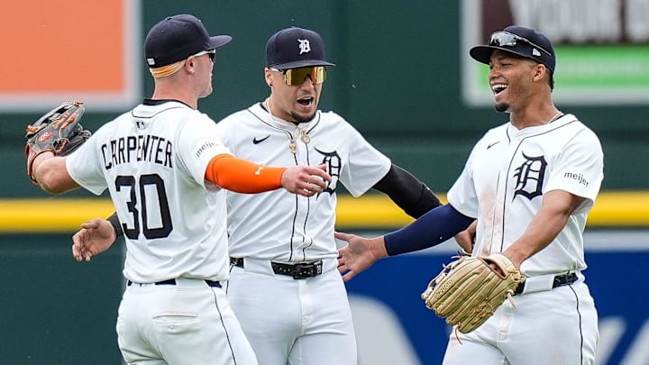 Detroit Tigers outfielders Kerry Carpenter (30), Javier Báez (28) and Wenceel Pérez (46) celebrate a 4-3 win over San Francisco Giants at Comerica Park.