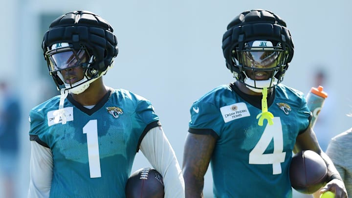 Jacksonville Jaguars running back Travis Etienne Jr. (1) and running back Tank Bigsby (4) walk together during the fourth day of the NFL football training camp practice session Saturday, July 27, 2024 at EverBank Stadium's Miller Electric Center in Jacksonville, Fla. [Bob Self/Florida Times-Union]
