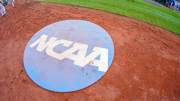 Jun 18, 2023: An on-deck circle with the NCAA logo is pictured on the field. Mandatory Credit: Dylan Widger-Imagn Images