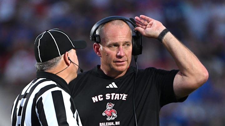 Sep 20, 2025; Durham, North Carolina, USA;  NC State Wolfpack head coach Dave Doeren reacts to a call during the fourth quarter against the Duke Blue Devils at Wallace Wade Stadium. Mandatory Credit: Zachary Taft-Imagn Images
