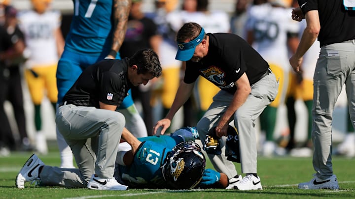 Jacksonville Jaguars wide receiver Christian Kirk (13) lies on the turf after sustaining an unknown injury as tight end Evan Engram (17) reacts during the fourth quarter of an NFL football matchup Sunday, Oct. 27, 2024 at EverBank Stadium in Jacksonville, Fla. The Packers edged the Jaguars 30-27 on a last-second field goal. [Corey Perrine/Florida Times-Union]
