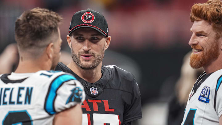 Jan 5, 2025; Atlanta, Georgia, USA; Atlanta Falcons quarterback Kirk Cousins (18) talks to Carolina Panthers wide receiver Adam Thielen (19) and quarterback Andy Dalton (14) after the game at Mercedes-Benz Stadium. Mandatory Credit: Dale Zanine-Imagn Images