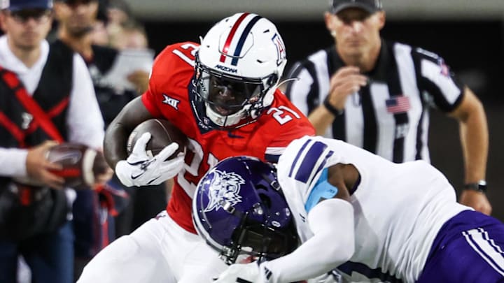 Sep 6, 2025; Tucson, Arizona, USA; Weber State Wildcats center back Tre Parks-Vinson (7) pushes Arizona Wildcats running back Ismail Mahdi (21) out of the bounds during the second quarter of the game at Arizona Stadium. Mandatory Credit: Aryanna Frank-Imagn Images