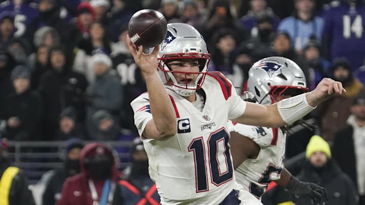 Dec 21, 2025; Baltimore, Maryland, USA;  New England Patriots quarterback Drake Maye (10) passes for a two-point conversion against the Baltimore Ravens during the second half of the game at M&T Bank Stadium. Mandatory Credit: James Lang-Imagn Images
