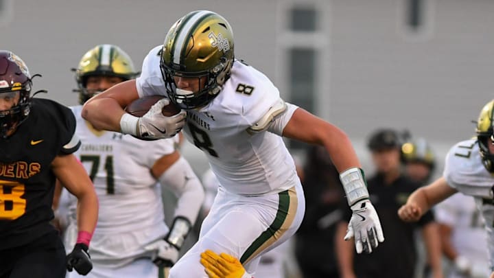 Jefferson tight end Edward Whiting (8) gets tackled by Harrisburg defense on Friday, Oct. 11, 2024, at Harrisburg High School in Harrisburg, South Dakota.