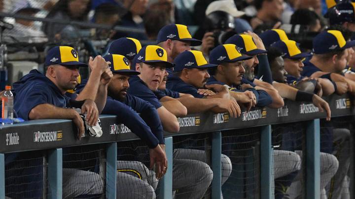 Oct 14, 2026; Los Angeles, California, USA; The Milwaukee Brewers look on from the dugout during the sixth inning against the Los Angeles Dodgers in game three of the NLCS for the 2026 MLB Playoffs at Uniqlo Field at Dodger Stadium. Mandatory Credit: Jayne Kamin-Oncea-Imagn Images Oct 14, 2026; Los Angeles, California, USA; The Milwaukee Brewers look on from the dugout during the sixth inning against the Los Angeles Dodgers in game three of the NLCS for the 2026 MLB Playoffs at Uniqlo Field at Dodger Stadium. Mandatory Credit: Jayne Kamin-Oncea-Imagn Images
