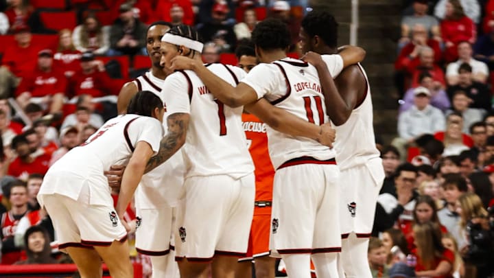 Jan 27, 2026; Raleigh, North Carolina, USA; NC State Wolfpack players huddle during the second half of the game against the Syracuse Orange at Lenovo Center. Mandatory Credit: Jaylynn Nash-Imagn Images