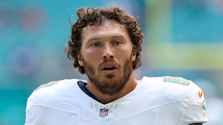 Miami Dolphins guard Cole Strange looks on before a game against the New England Patriots