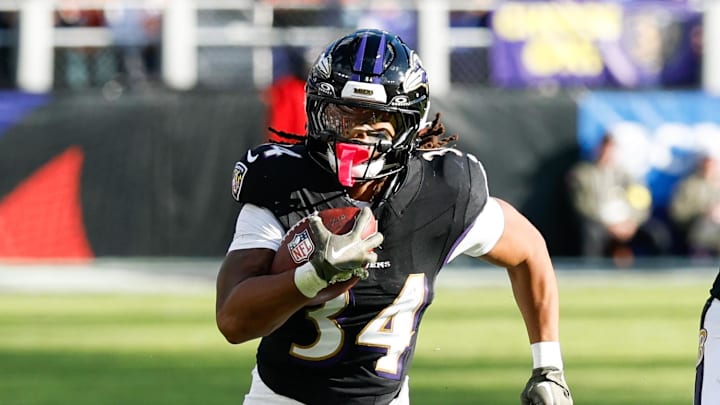 Oct 26, 2025; Baltimore, Maryland, USA;  Baltimore Ravens running back Keaton Mitchell (34) rushes during the fourth quarter against the Chicago Bears at M&T Bank Stadium. Mandatory Credit: Geoff Burke-Imagn Images