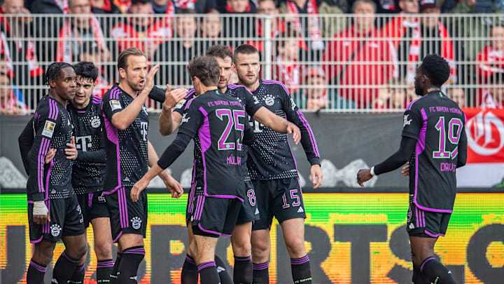 Bayern Munich players celebrating after scoring goal against Union Berlin.