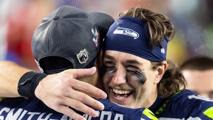 Seattle Seahawks wide receiver Jake Bobo celebrates with Jaxon Smith-Njigba