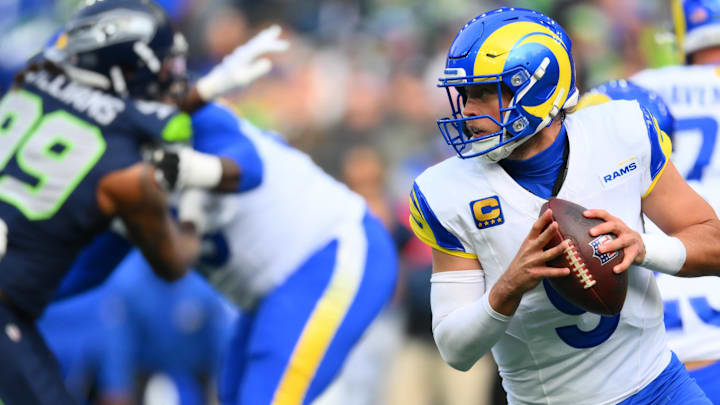 Nov 3, 2024; Seattle, Washington, USA; Los Angeles Rams quarterback Matthew Stafford (9) looks to pass the ball against the Seattle Seahawks during the first half at Lumen Field. Mandatory Credit: Steven Bisig-Imagn Images Nov 3, 2024; Seattle, Washington, USA; Los Angeles Rams quarterback Matthew Stafford (9) looks to pass the ball against the Seattle Seahawks during the first half at Lumen Field. Mandatory Credit: Steven Bisig-Imagn Images
