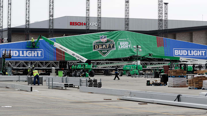 Crews work to raise the roof of the NFL draft theater on April 9, 2025, in the parking lot of Lambeau Field in Green Bay, Wis. Crews work to raise the roof of the NFL draft theater on April 9, 2025, in the parking lot of Lambeau Field in Green Bay, Wis.