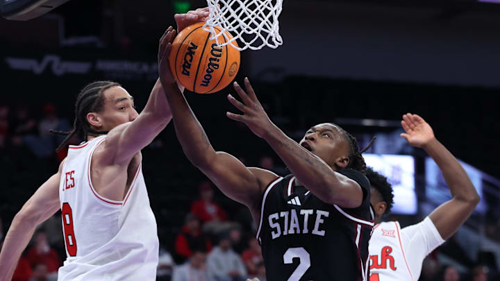 Mississippi State Bulldogs guard Ja'Borri McGhee (2) has a shot blocked by Utah Utes forward Keanu Dawes (8) during the first half at Delta Center. Mississippi State Bulldogs guard Ja'Borri McGhee (2) has a shot blocked by Utah Utes forward Keanu Dawes (8) during the first half at Delta Center.