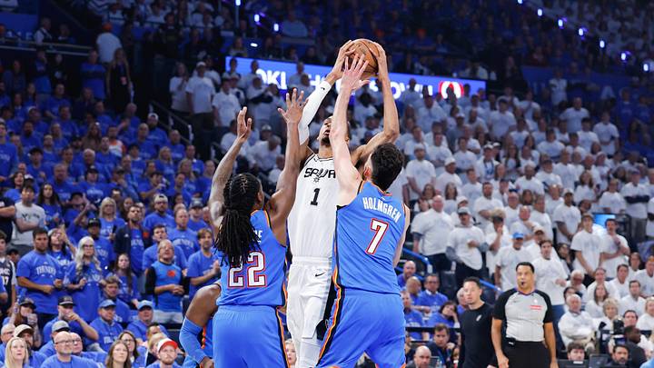 May 20, 2026; Oklahoma City, Oklahoma, USA; San Antonio Spurs forward Victor Wembanyama (1) looks to shoot as Oklahoma City Thunder guard Cason Wallace (22) and Oklahoma City Thunder center Chet Holmgren (7) defend during the first quarter during game two of the western conference finals for the 2026 NBA playoffs at Paycom Center. Mandatory Credit: Alonzo Adams-Imagn Images May 20, 2026; Oklahoma City, Oklahoma, USA; San Antonio Spurs forward Victor Wembanyama (1) looks to shoot as Oklahoma City Thunder guard Cason Wallace (22) and Oklahoma City Thunder center Chet Holmgren (7) defend during the first quarter during game two of the western conference finals for the 2026 NBA playoffs at Paycom Center. Mandatory Credit: Alonzo Adams-Imagn Images